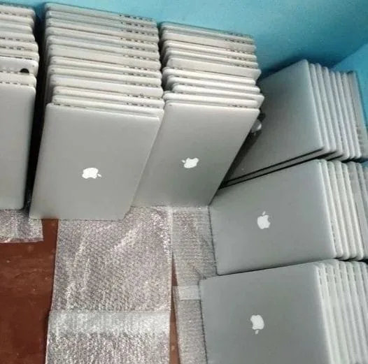 Renewed MacBooks packed in protective wrap before handover